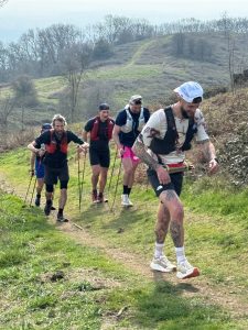 group of ultrarunners training together in mountains showing teamwork in ultrarunning