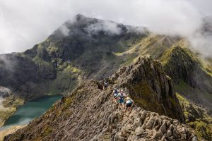Ourea Events - Dragon's Back Race 2024, tackling the mighty Crib Goch with sheer drops either side and the towering Yr Wyddfa (Snowdon).